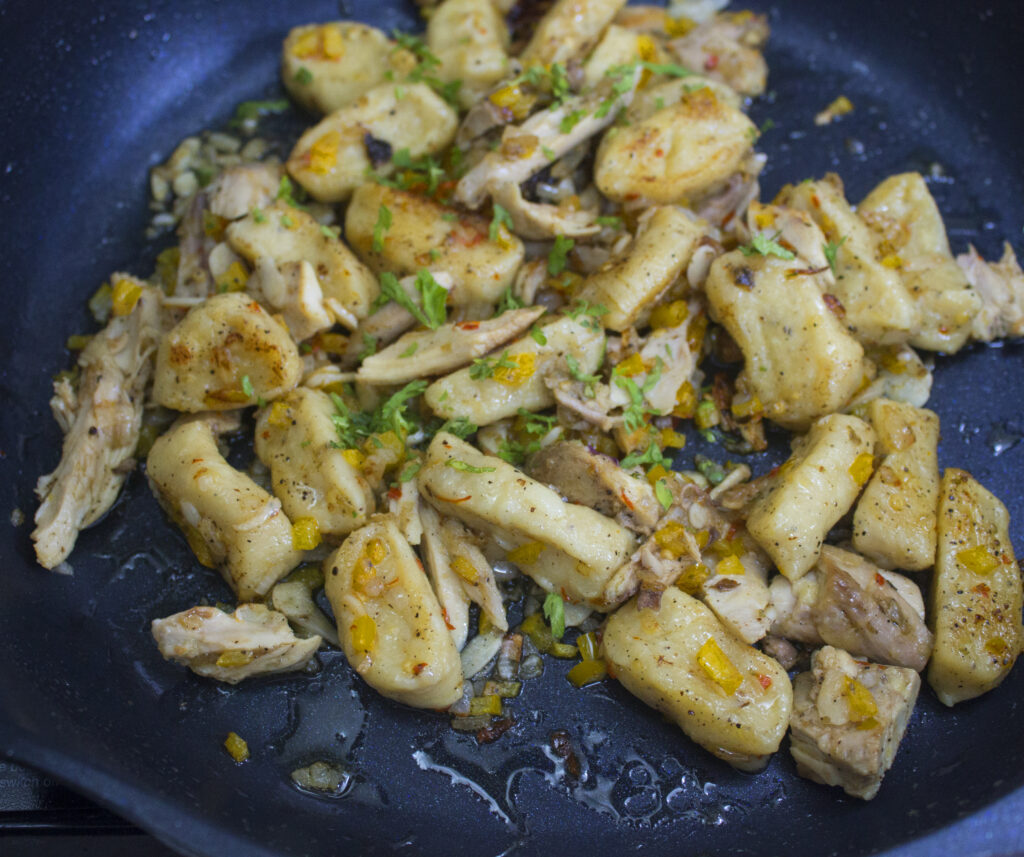 Gnocchi Aglio e Olio being cooked in a pan