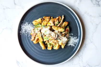 Plate of gnocchi with chicken aglio e olio dressing