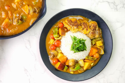 Japanese Curry Rice with potatoes, chicken, carrots and bell peppers in a plate.