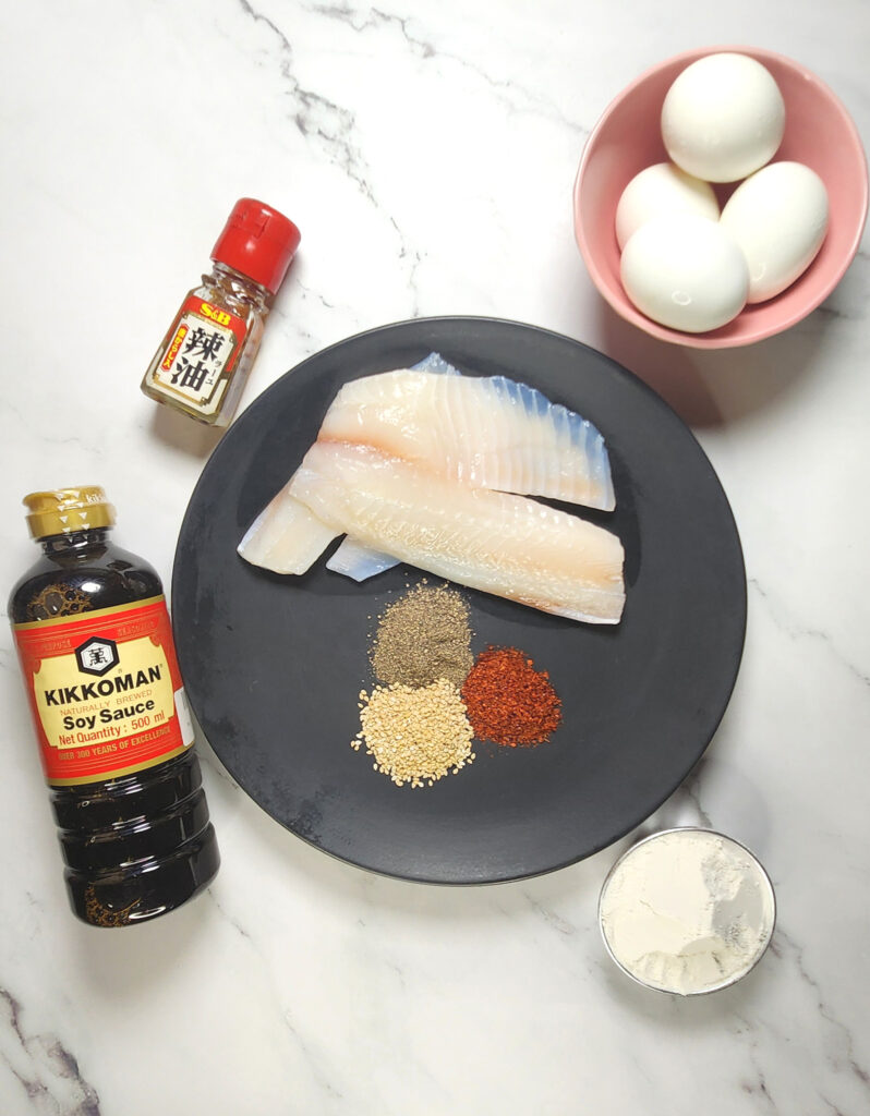 Korean Saeng Sun Jun : Quick Pan Fried Fish ingredients, flour, egg, sesame seeds, fish fillets, soy sauce, chilli powder, pepper, toasted sesame oil