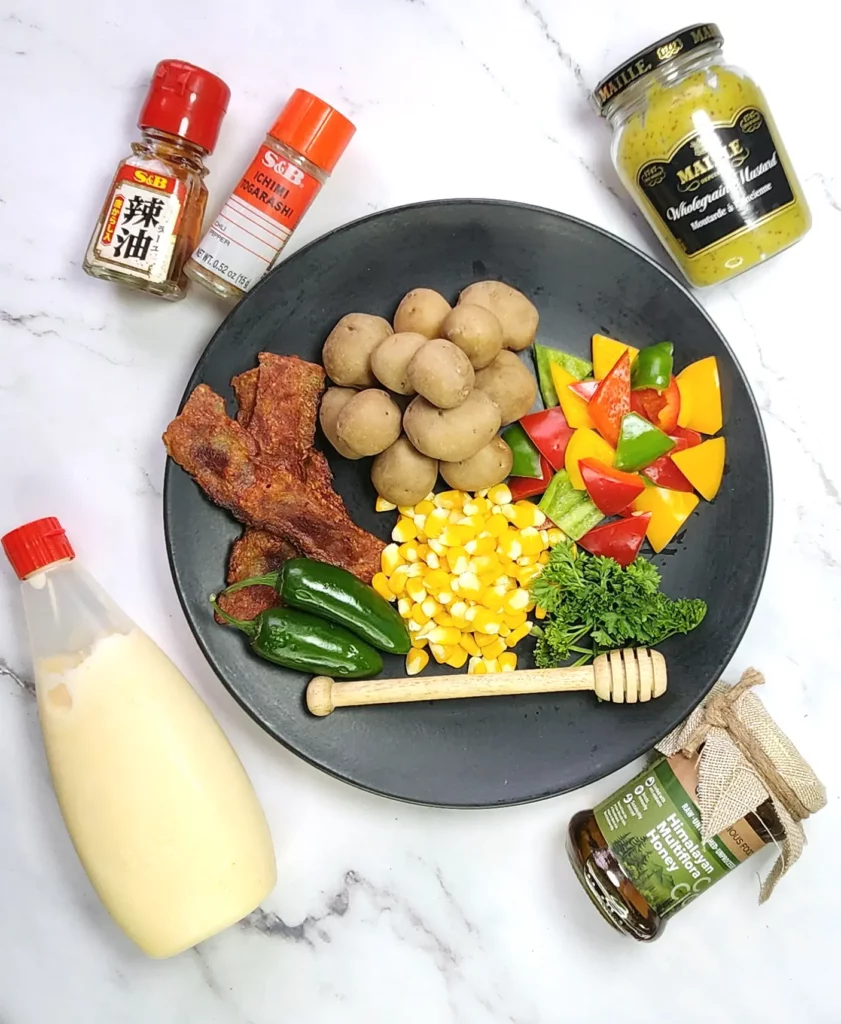 Japanese fusion potato salad ingredients - mustard, Kewpie mayonnaise, honey, toasted sesame oil, baby potatoes, bacon, bell peppers, corn, parsley, jalapenos