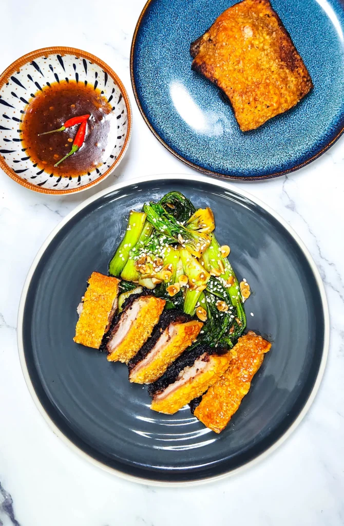 Chinese crispy pork belly with stir fried bok choy and sweet chilli sauce