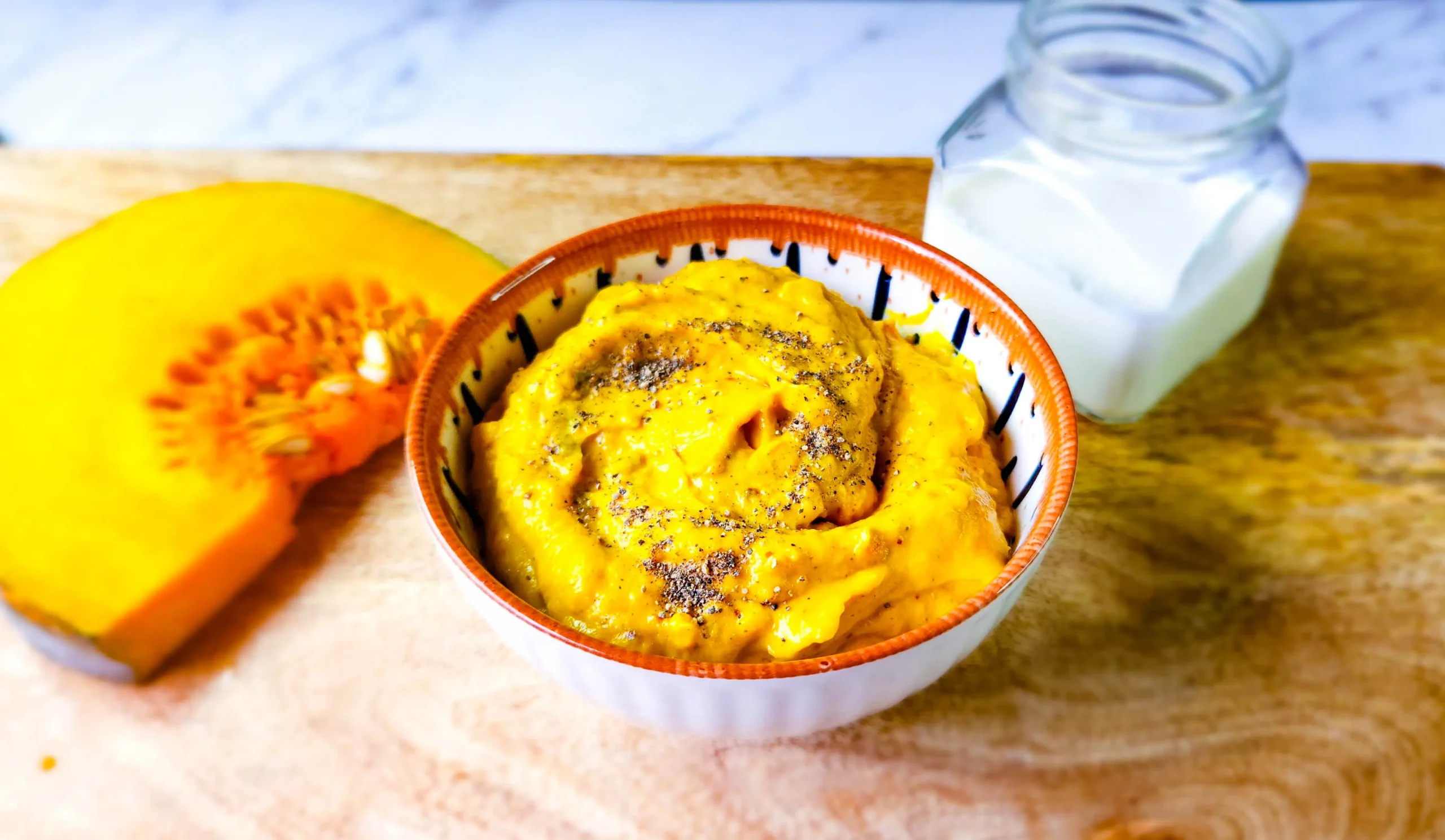 Creamy mashed pumpkin with pumpkin, cream, and black pepper