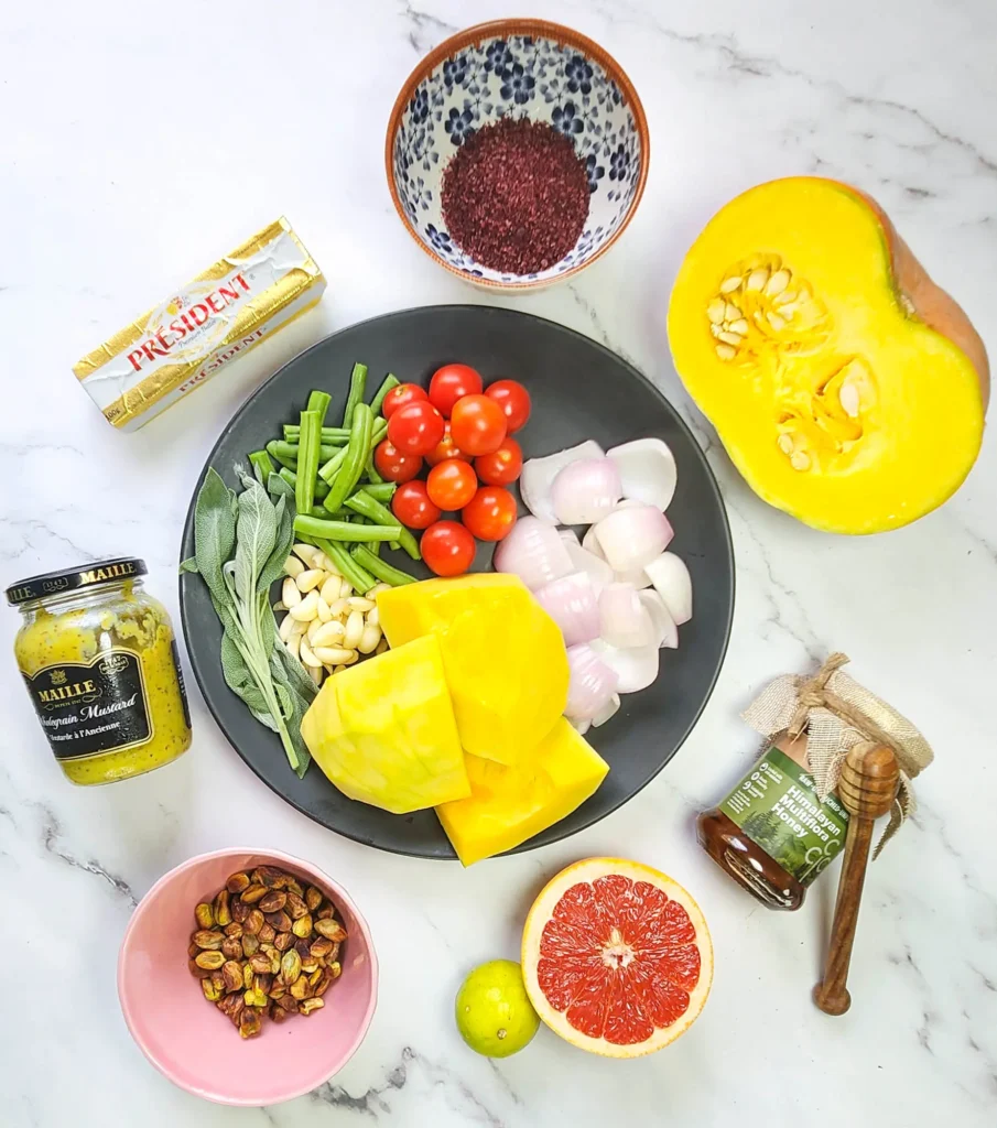 Roasted pumpkin salad ingredients cherry tomatoes, pistachios, beans, onions, pumpkin, butter, garlic and sage leaves. Sumac, mustard sauce, lime, honey and grapefruit dressing.