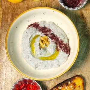 Black Sesame Labneh Dip Recipe final photo with confit garlic, toast, sumac, lemon and pickled peppers